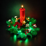 Angled view of illuminated Christmas Table Decoration 40743 with candle and wreath lighting