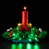 Low front view of Christmas Table Decoration 40743 with green lighting around the base