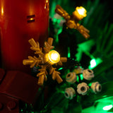 Gold snowflake and red candle detail with warm yellow lighting on Christmas Table Decoration 40743