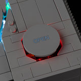 Close-up of red lighting beneath the open button on LEGO PlayStation 72306